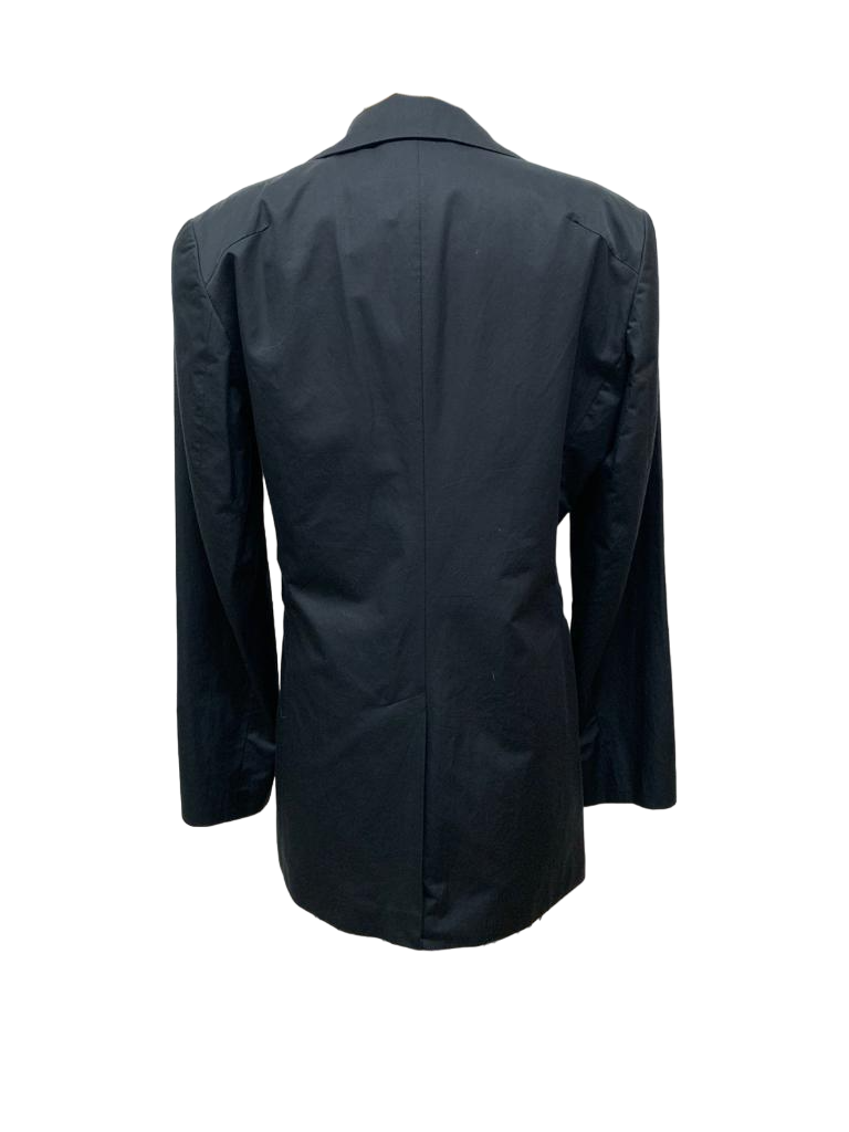 Back of black cotton jacket with white and black striped inner lining and large pockets