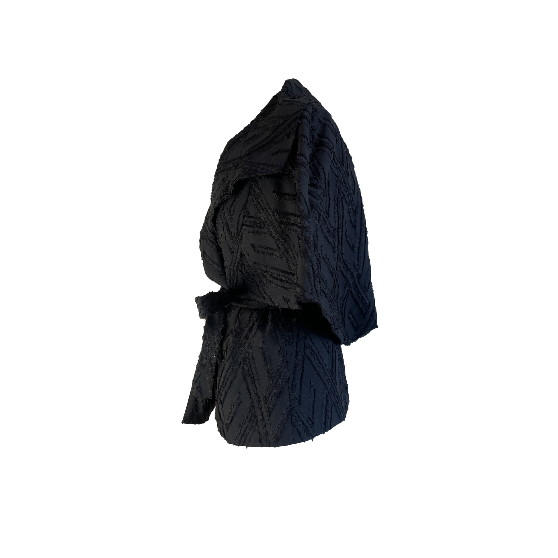 Side of black wool blend wrap jacket with transformable cape with black fringed detail