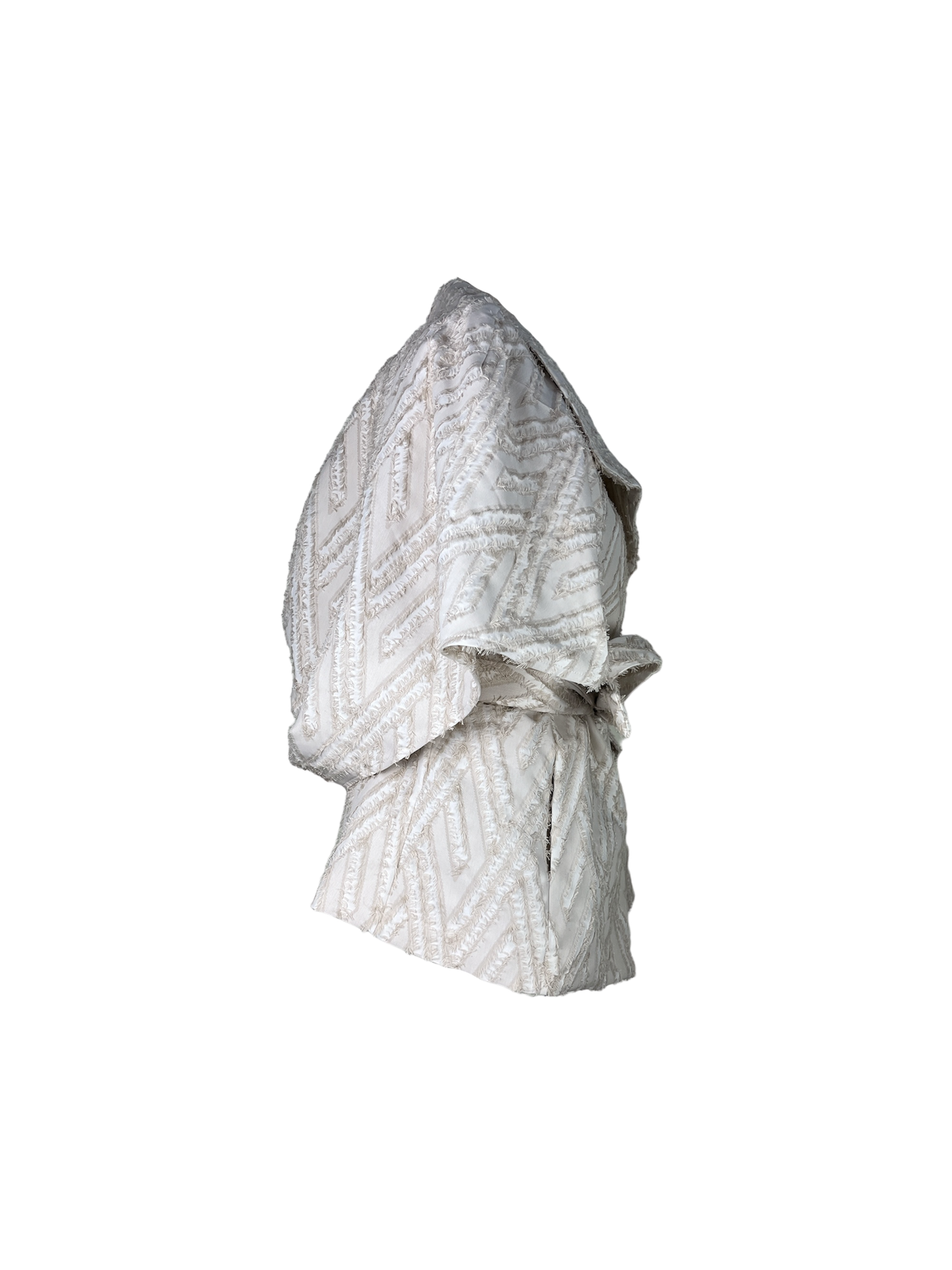 Side of ecru wool blend wrap jacket with transformable cape with white fringed detail