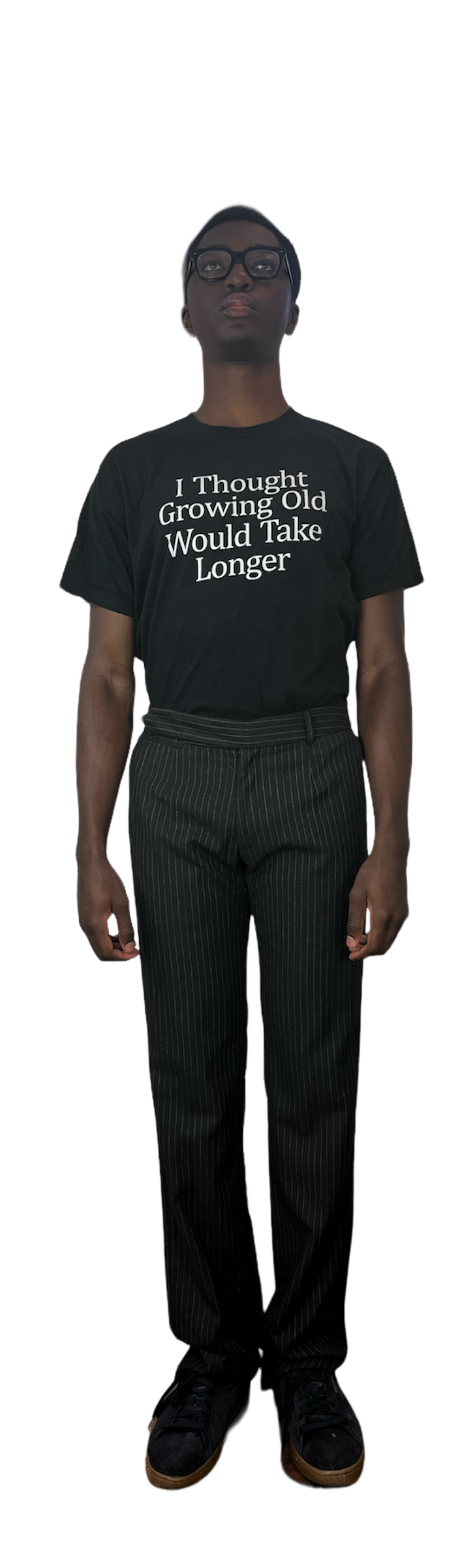 Man in a graphic t shirt wearing black and white stripe pants