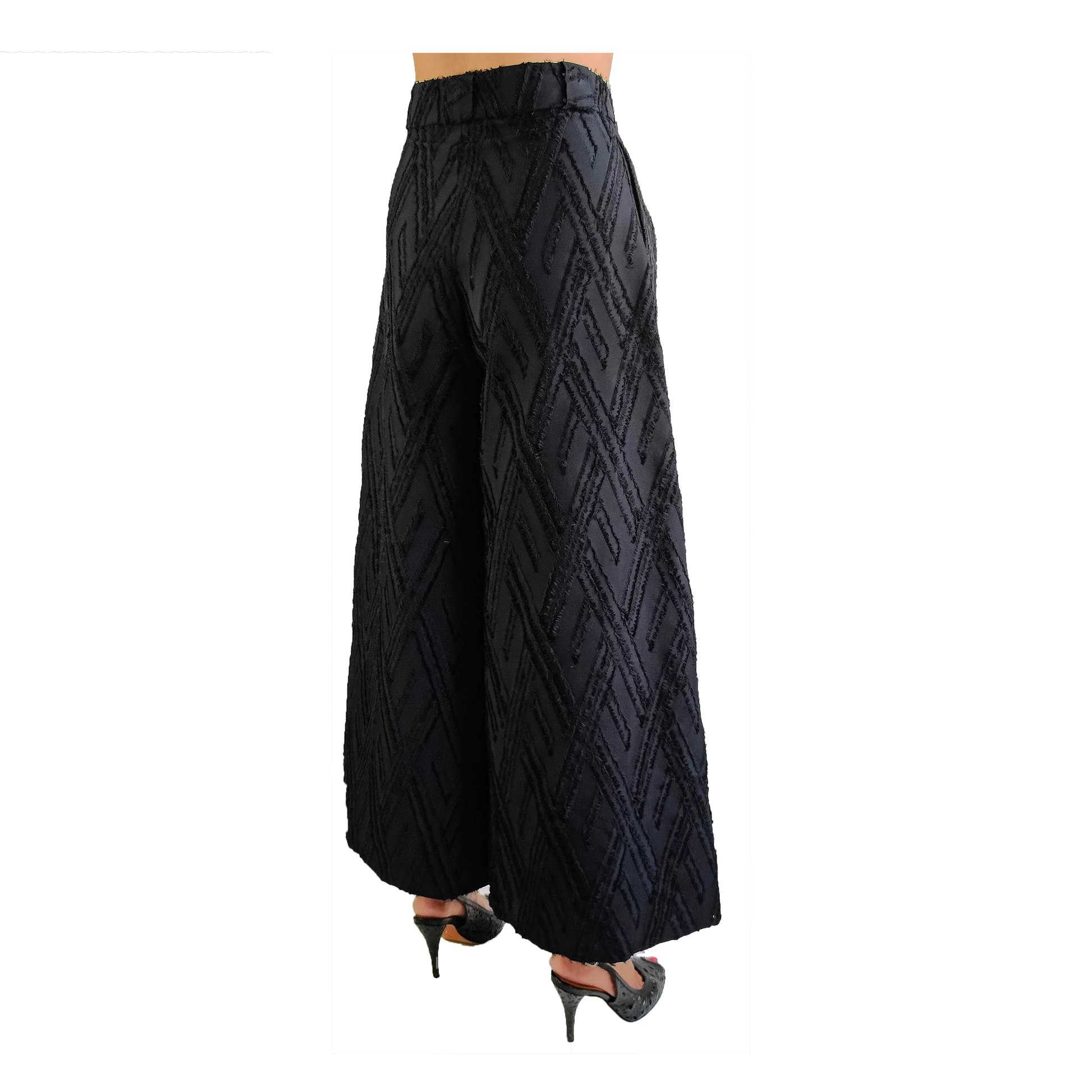 Side of black wide legged wool pants with frayed herringbone detailing