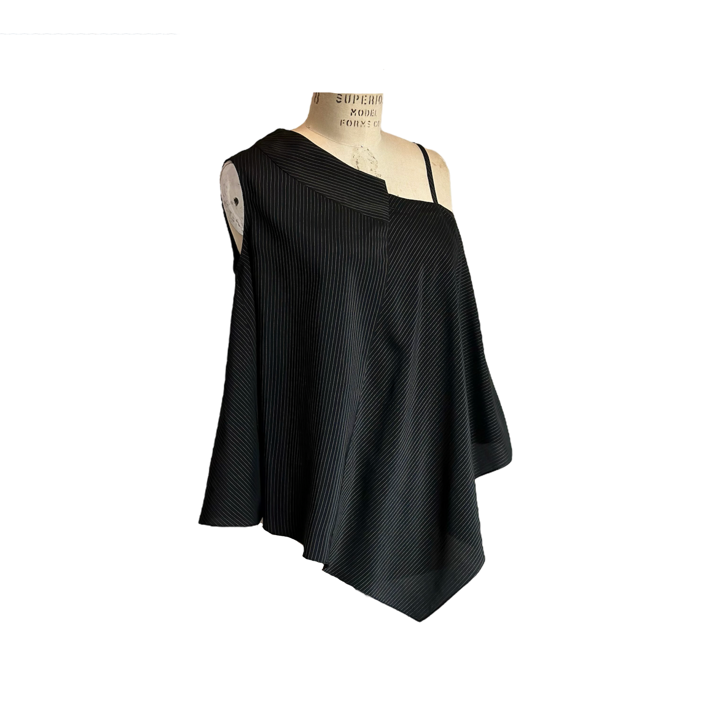 Side of black one shoulder top with white pinstripe pattern