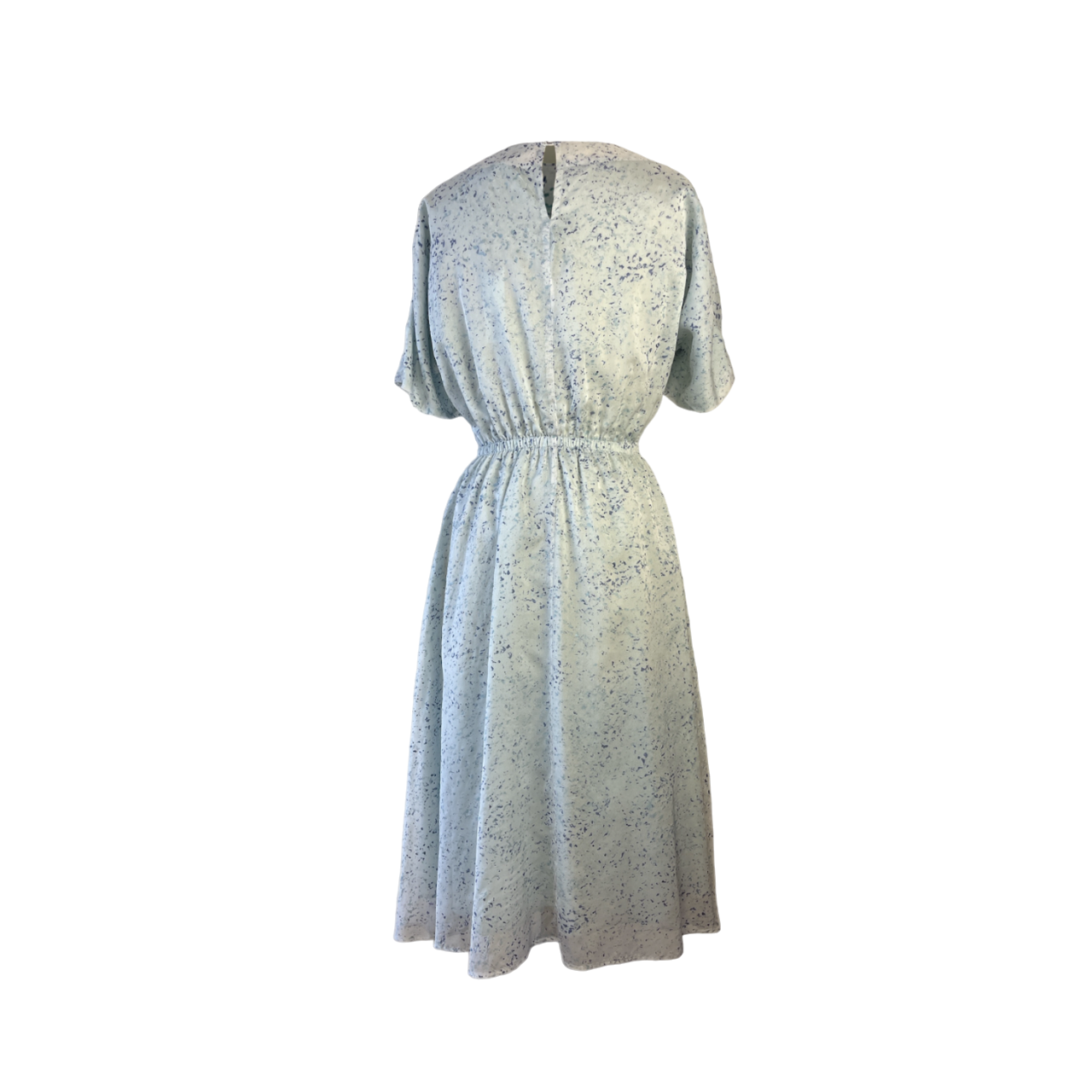 Back of white speckled midi dress with drawstring detail, adjustable sleeves, and gathered waist