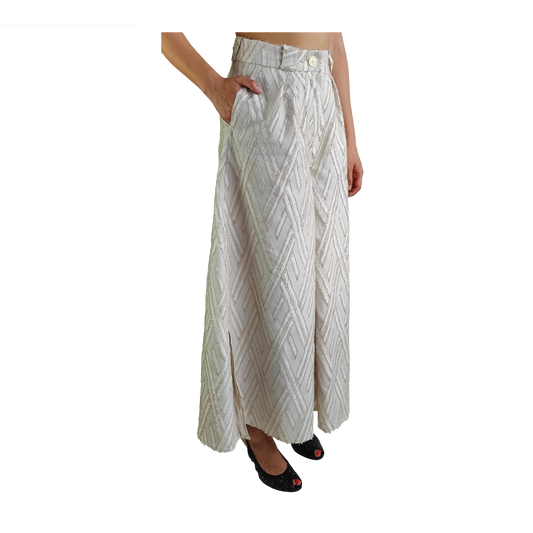 Side of white wide legged wool pants with frayed herringbone detailing