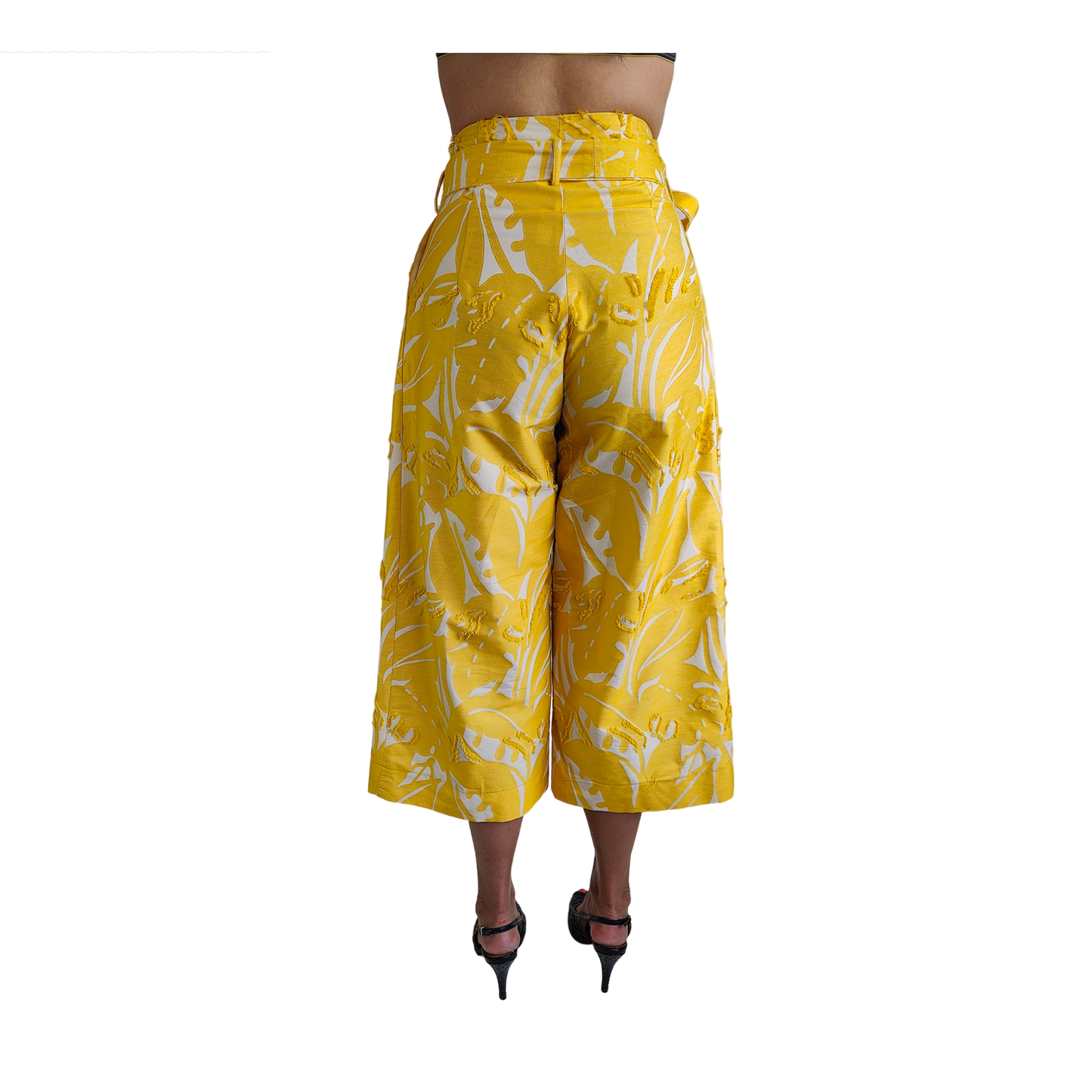 Back of reversible yellow cropped wide leg gaucho style pant with white patterns