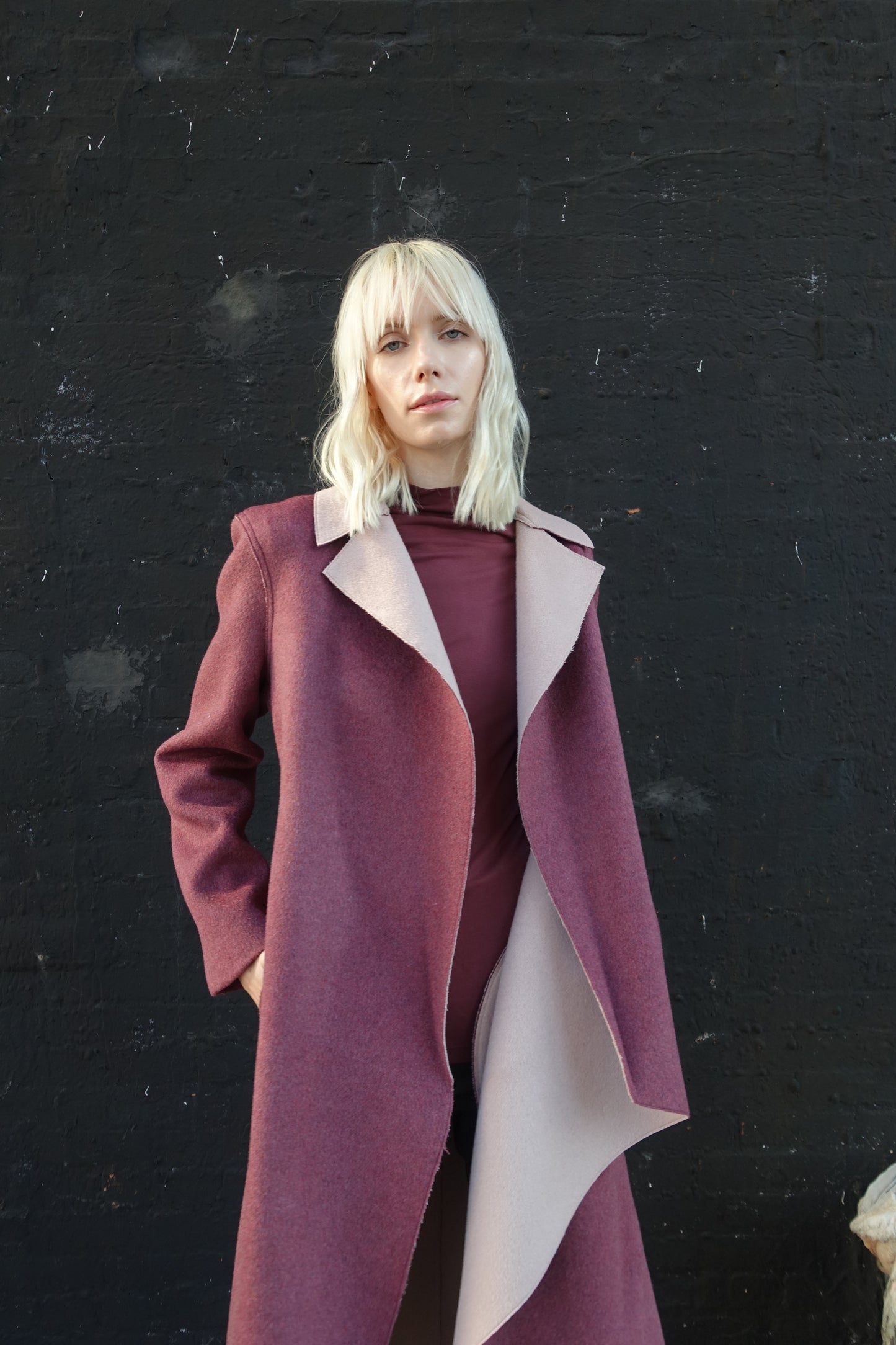Woman wearing a tailored look double-face wool and cashmere blend raspberry pink coat